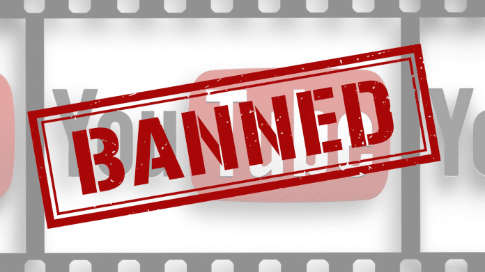 YouTube monetization update warning banner showing banned content symbol